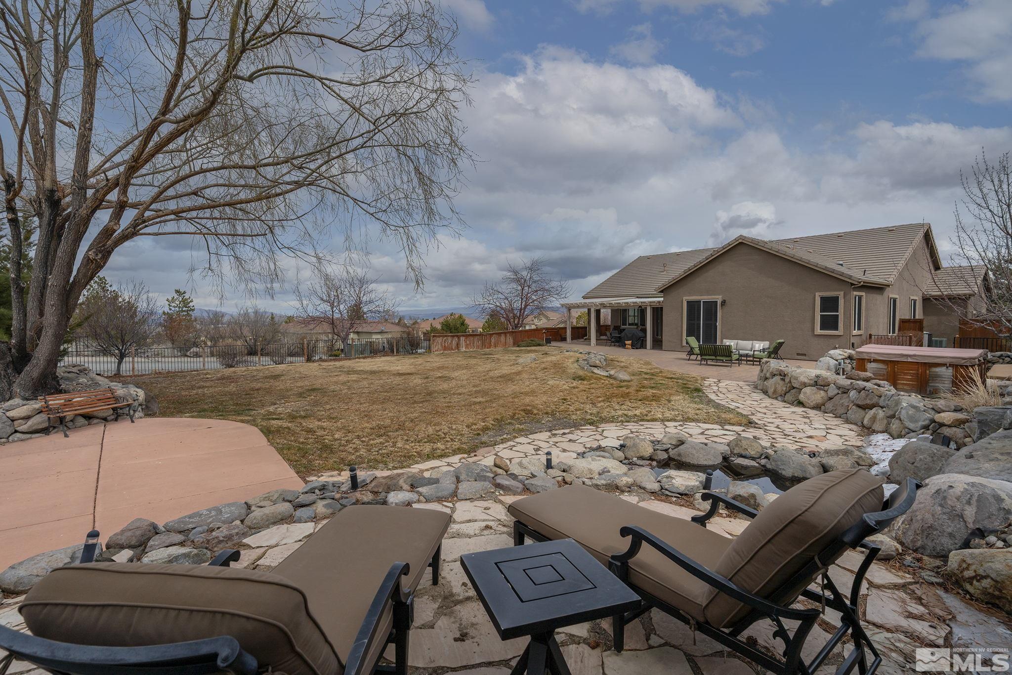 5630 North White Sands Road Reno, NV 89511 - Photo 33 of 40 a terrace of a house with outdoor seating