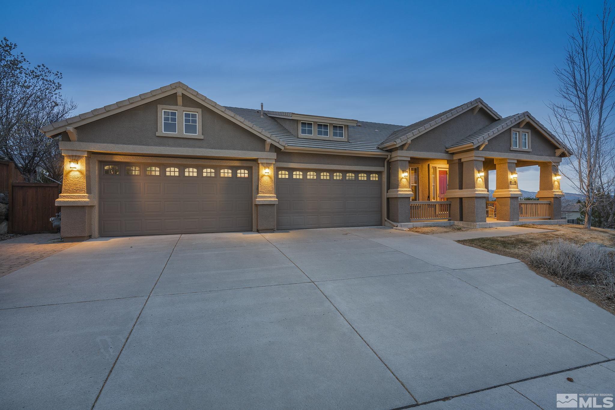 5630 North White Sands Road Reno, NV 89511 - Photo 39 of 40 a front view of a house with yard and garage