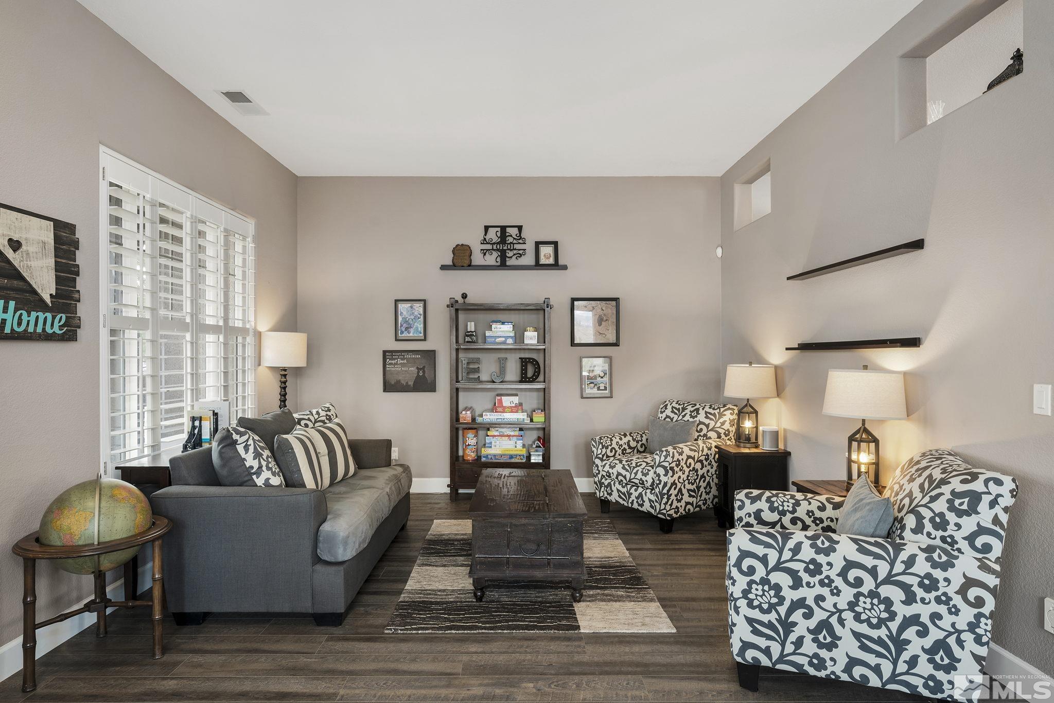 5630 North White Sands Road Reno, NV 89511 - Photo 4 of 40 a living room with furniture and decor