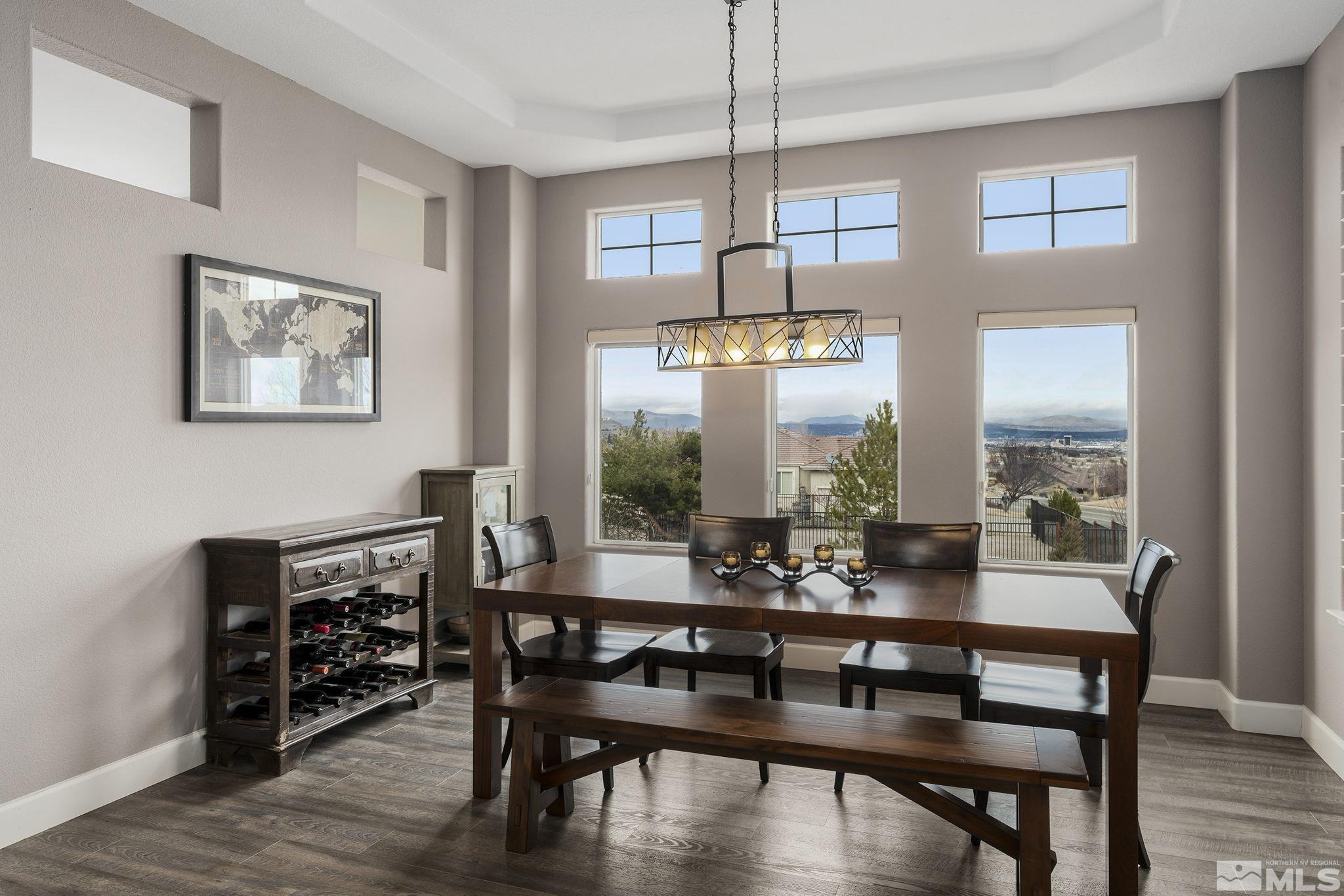 5630 North White Sands Road Reno, NV 89511 - Photo 5 of 40 a view of a dining room with furniture window and wooden floor
