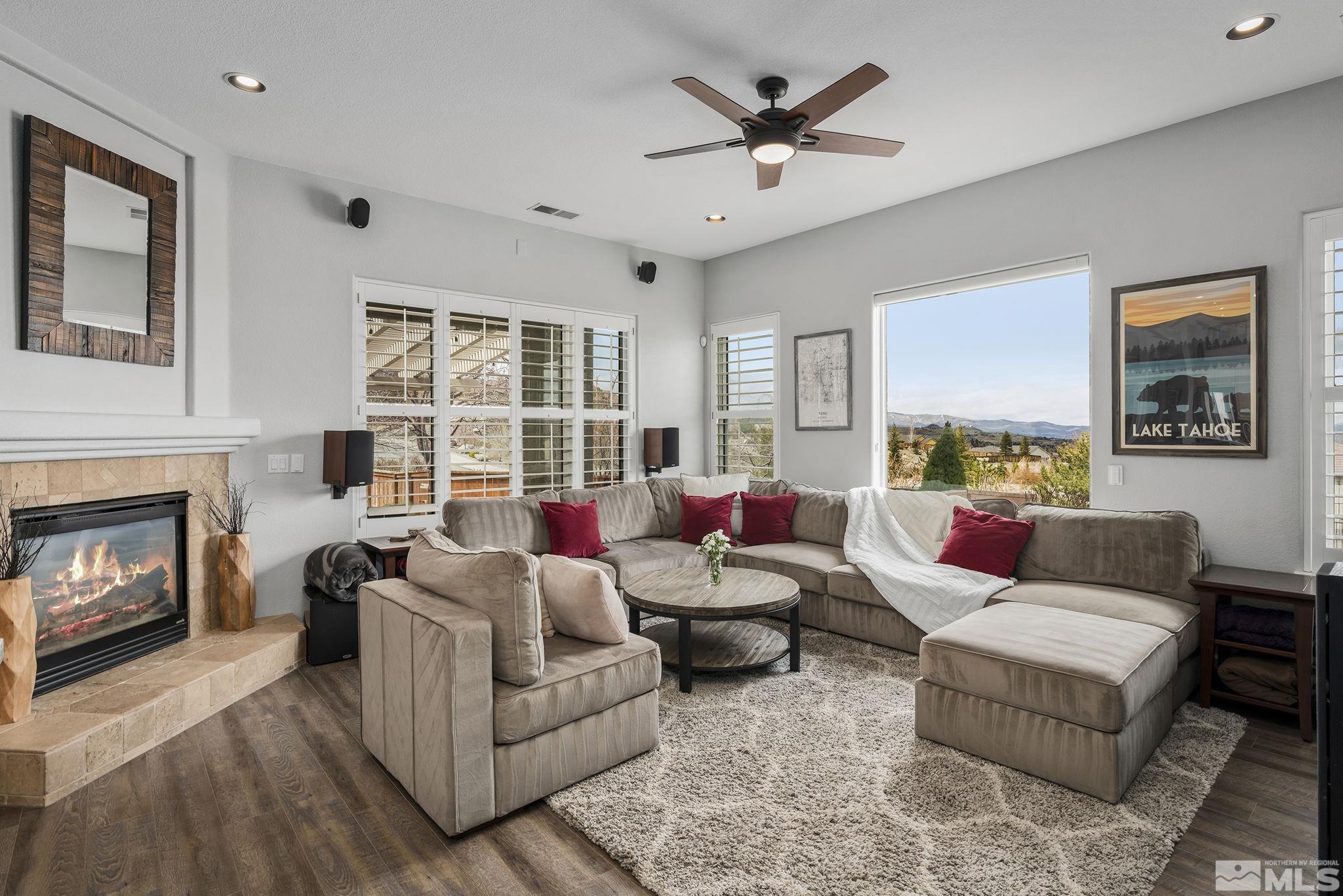 5630 North White Sands Road Reno, NV 89511 - Photo 6 of 40 a living room with furniture and a fireplace
