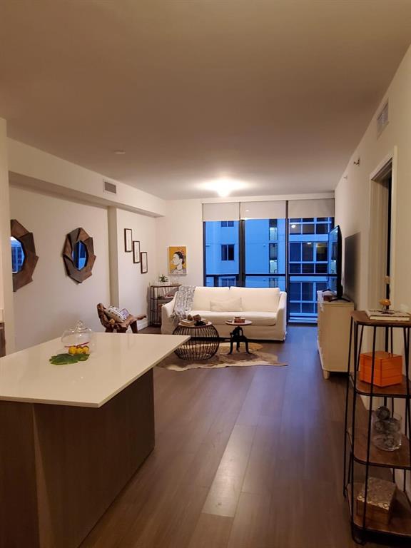 201 Southwest 17th Road, Unit 704 Miami, FL 33129 - Photo 20 of 60 a living room with furniture and a wooden floor