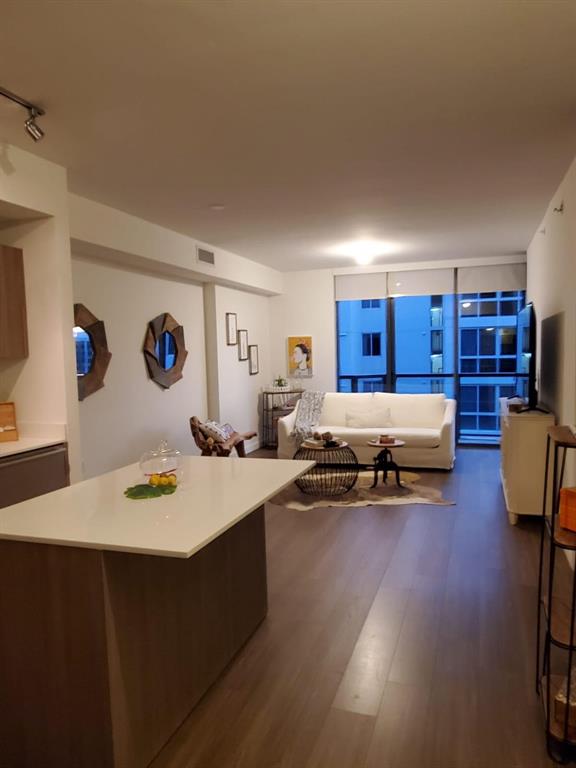 201 Southwest 17th Road, Unit 704 Miami, FL 33129 - Photo 21 of 60 a living room with furniture and a wooden floor