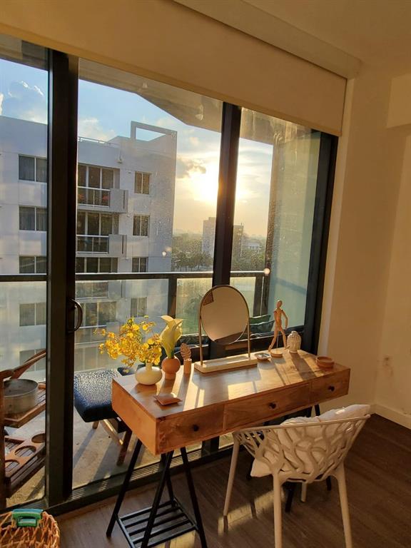 201 Southwest 17th Road, Unit 704 Miami, FL 33129 - Photo 24 of 60 a view of a balcony dining table and chairs
