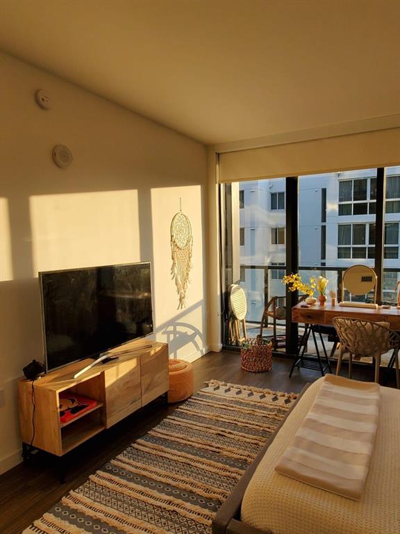 201 Southwest 17th Road, Unit 704 Miami, FL 33129 - Photo 25 of 60 a living room with furniture and a flat screen tv