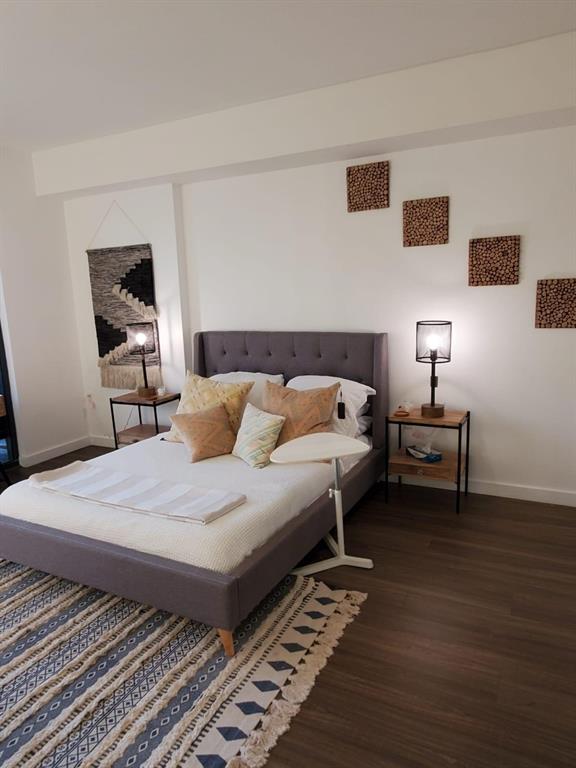 201 Southwest 17th Road, Unit 704 Miami, FL 33129 - Photo 30 of 60 a bedroom with bed and a window