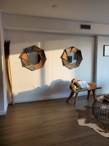 a view of workspace with wooden floor and windows