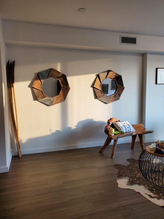 201 Southwest 17th Road, Unit 704 Miami, FL 33129 - Photo 10 of 60 a living room with furniture and a wooden floor