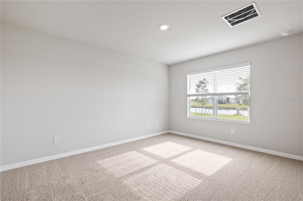 9498 Turtle Grass Circle Punta Gorda, FL 33950 - Photo 12 of 21 an empty room with a window