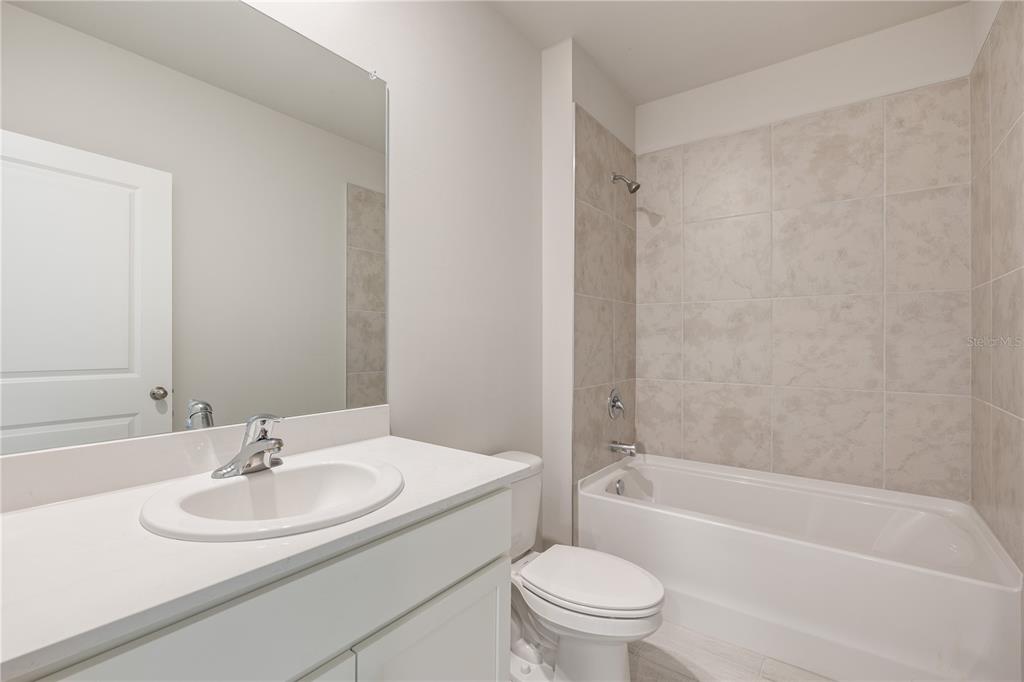 9498 Turtle Grass Circle Punta Gorda, FL 33950 - Photo 15 of 21 a bathroom with a sink toilet and a bathtub