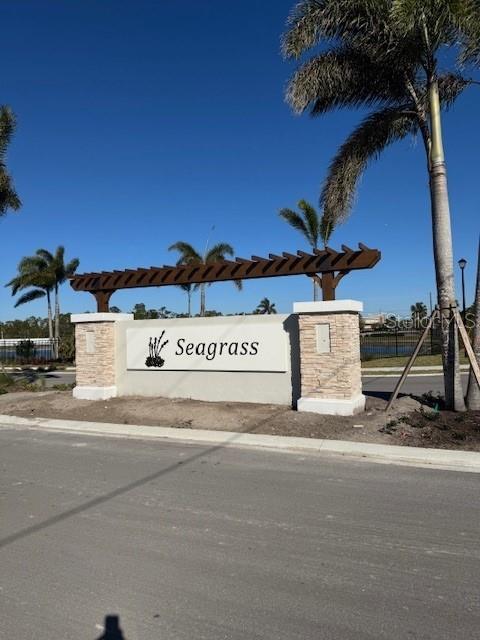 9498 Turtle Grass Circle Punta Gorda, FL 33950 - Photo 20 of 21 a view of a street with houses