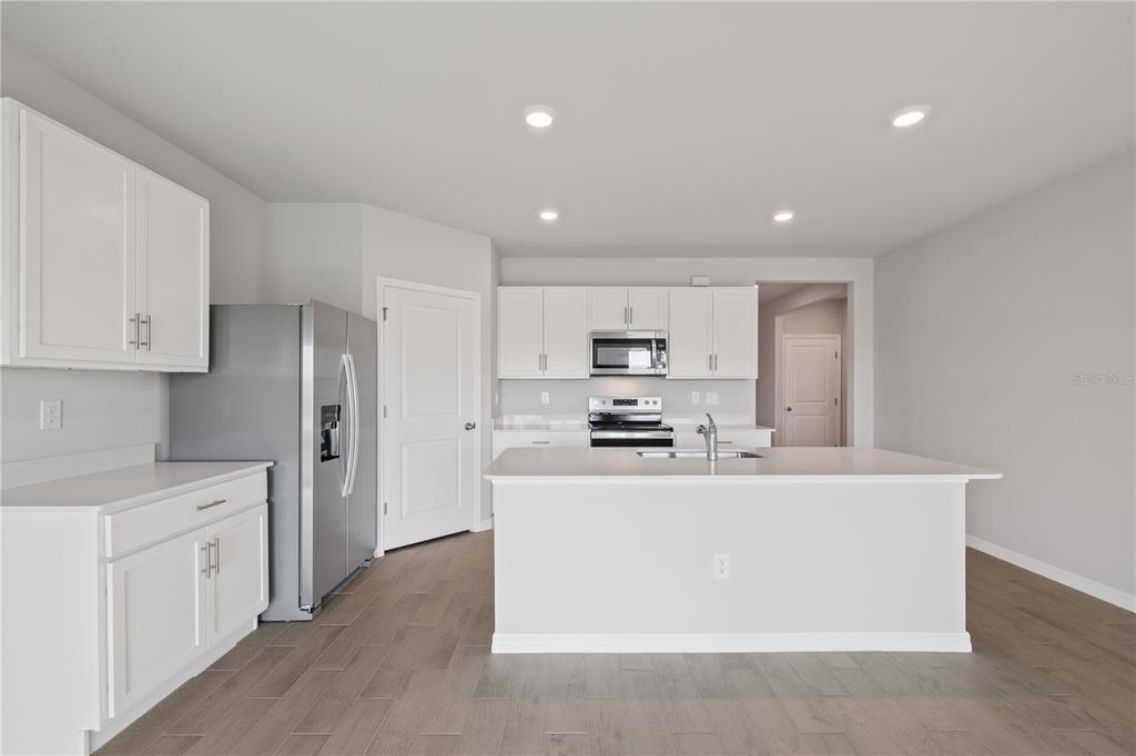 9498 Turtle Grass Circle Punta Gorda, FL 33950 - Photo 6 of 21 a view of a kitchen with stainless steel appliances