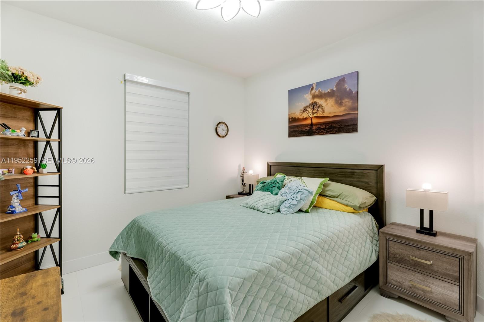 19410 Southwest 124th Court Miami, FL 33177 - Photo 14 of 33 a bedroom with a bed and a window