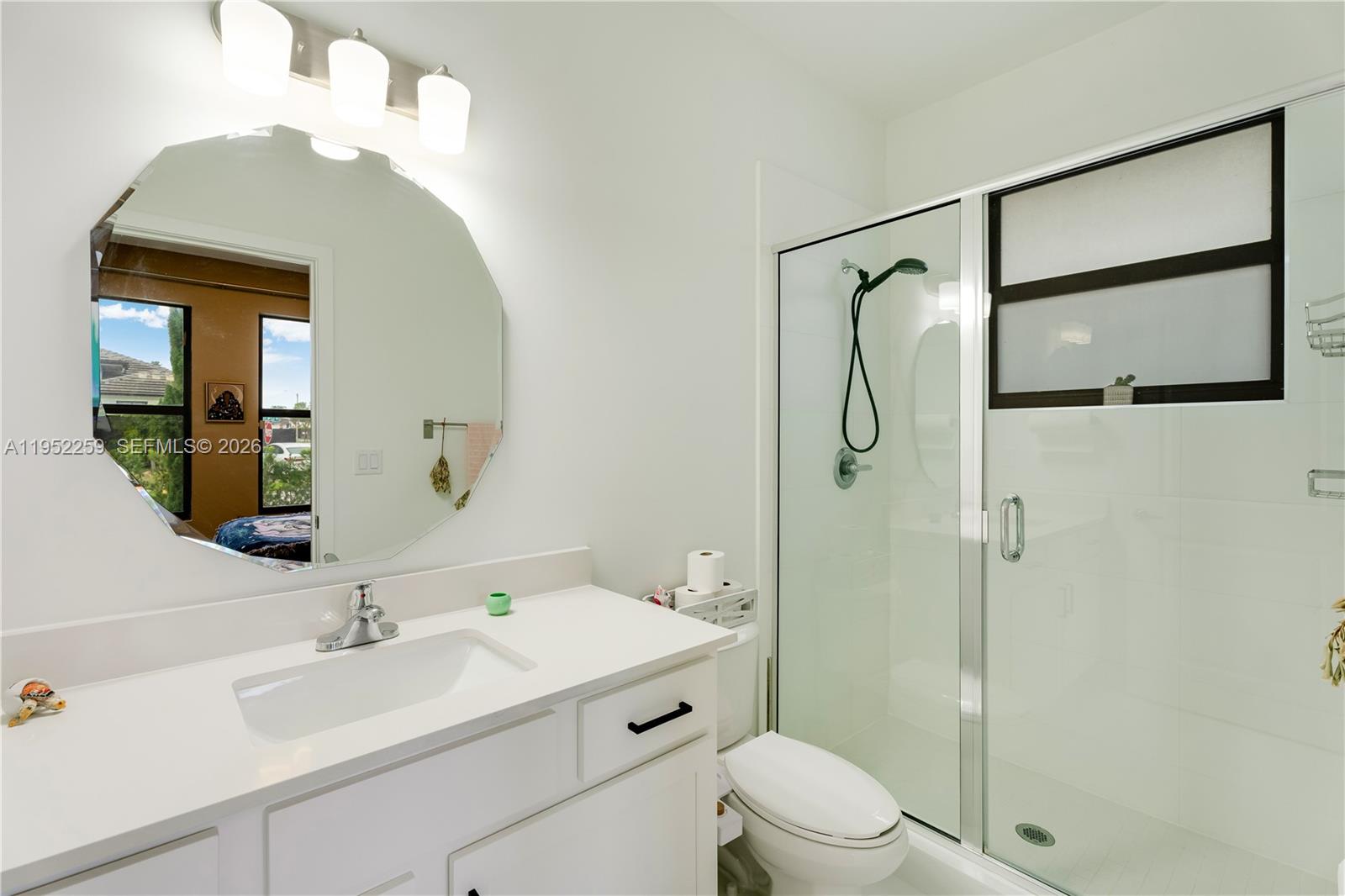 19410 Southwest 124th Court Miami, FL 33177 - Photo 21 of 33 a bathroom with a sink toilet and shower