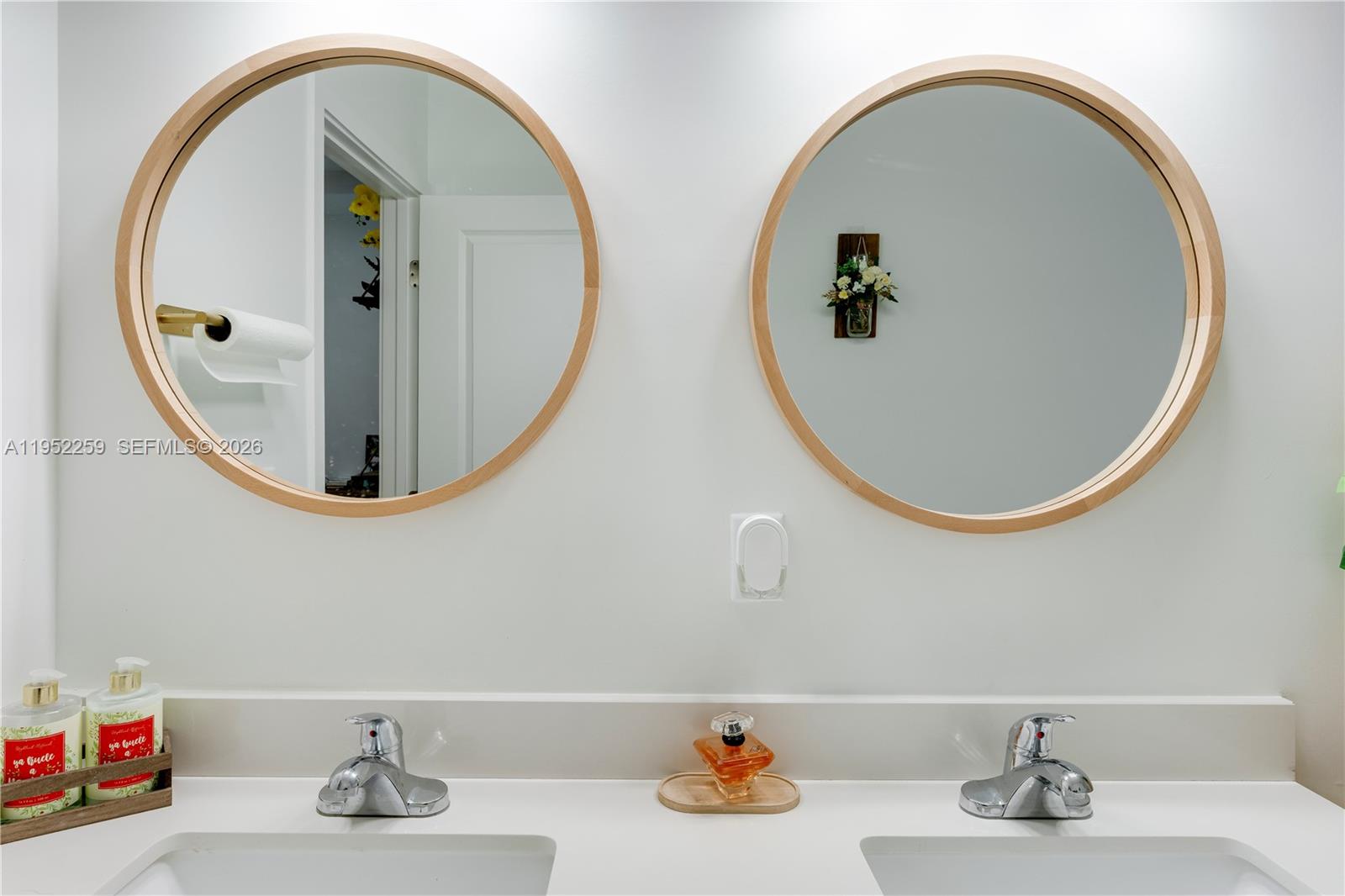19410 Southwest 124th Court Miami, FL 33177 - Photo 22 of 33 a bathroom with a mirror and a sink