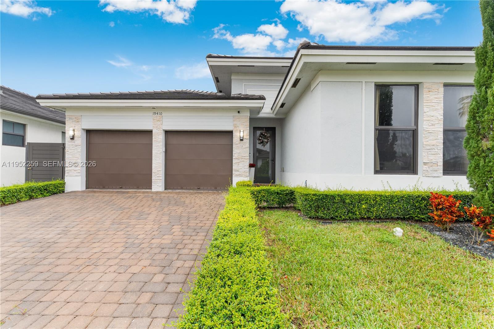 19410 Southwest 124th Court Miami, FL 33177 - Photo 27 of 33 a front view of a house with garden
