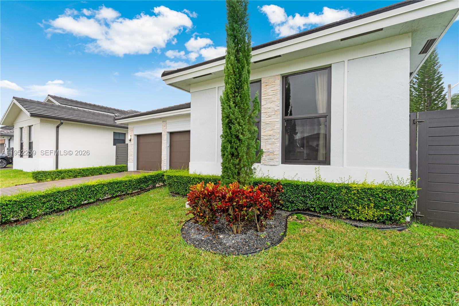 19410 Southwest 124th Court Miami, FL 33177 - Photo 28 of 33 a front view of a house with garden