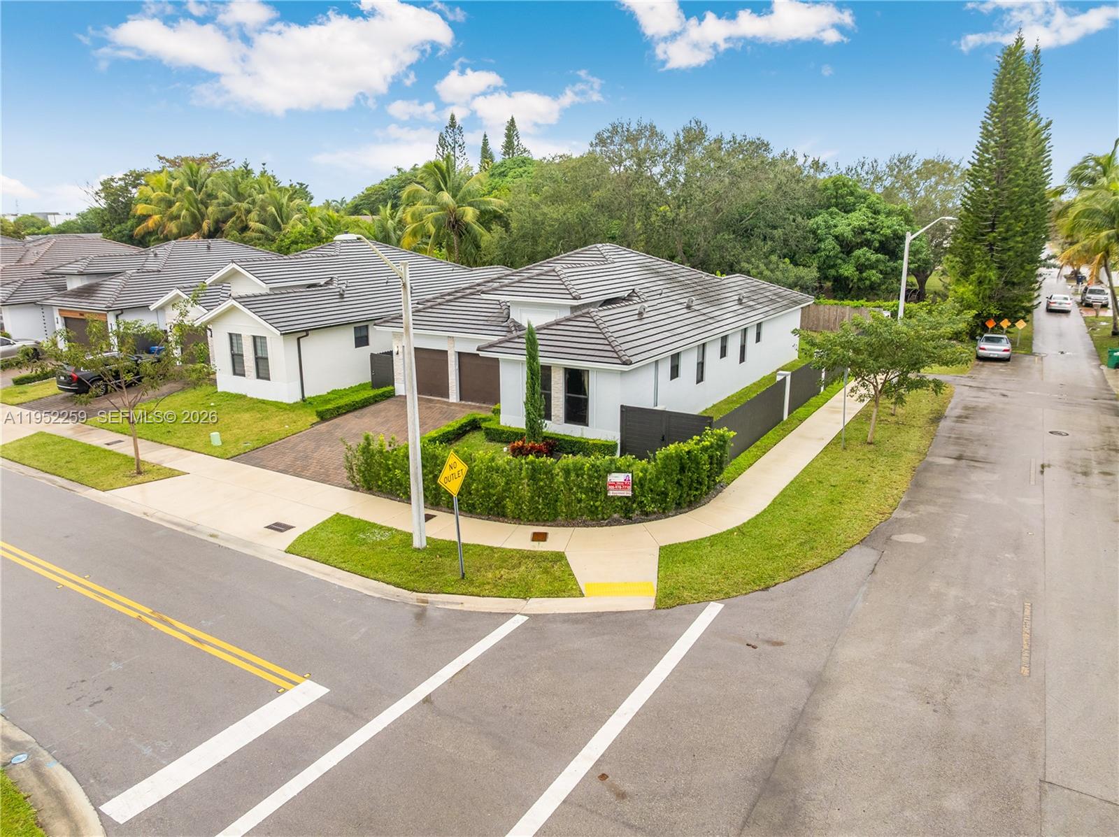 19410 Southwest 124th Court Miami, FL 33177 - Photo 33 of 33 a view of a house with a garden and pathway