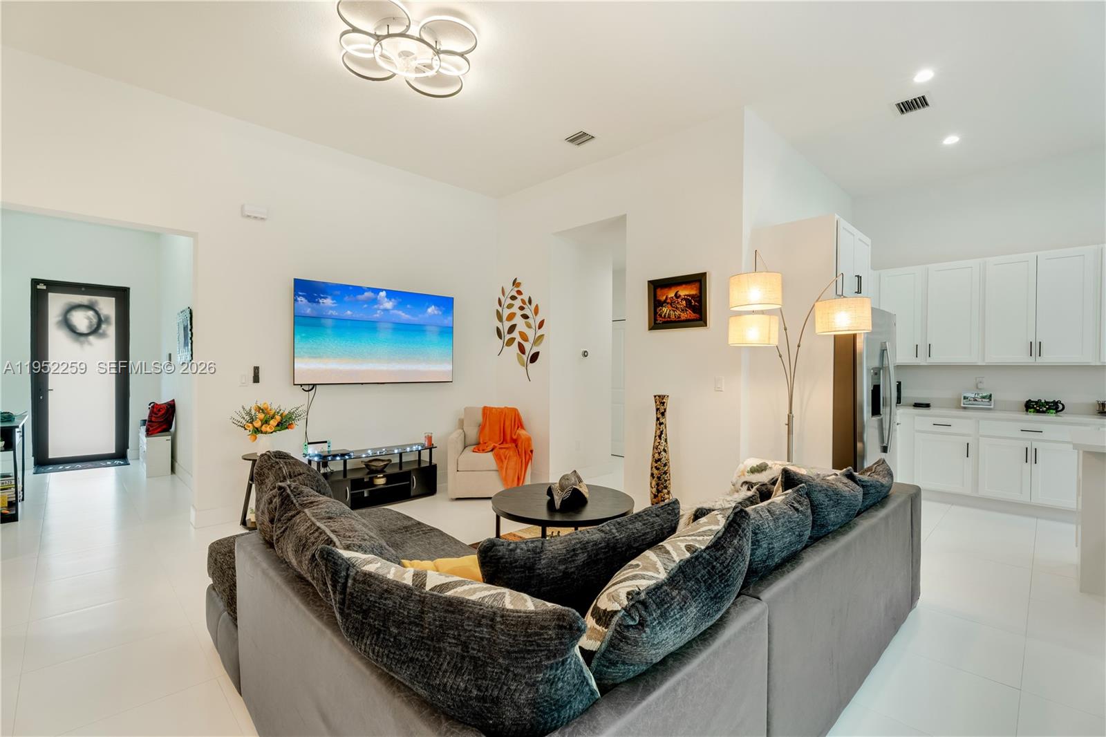 19410 Southwest 124th Court Miami, FL 33177 - Photo 5 of 33 a living room with furniture and a flat screen tv