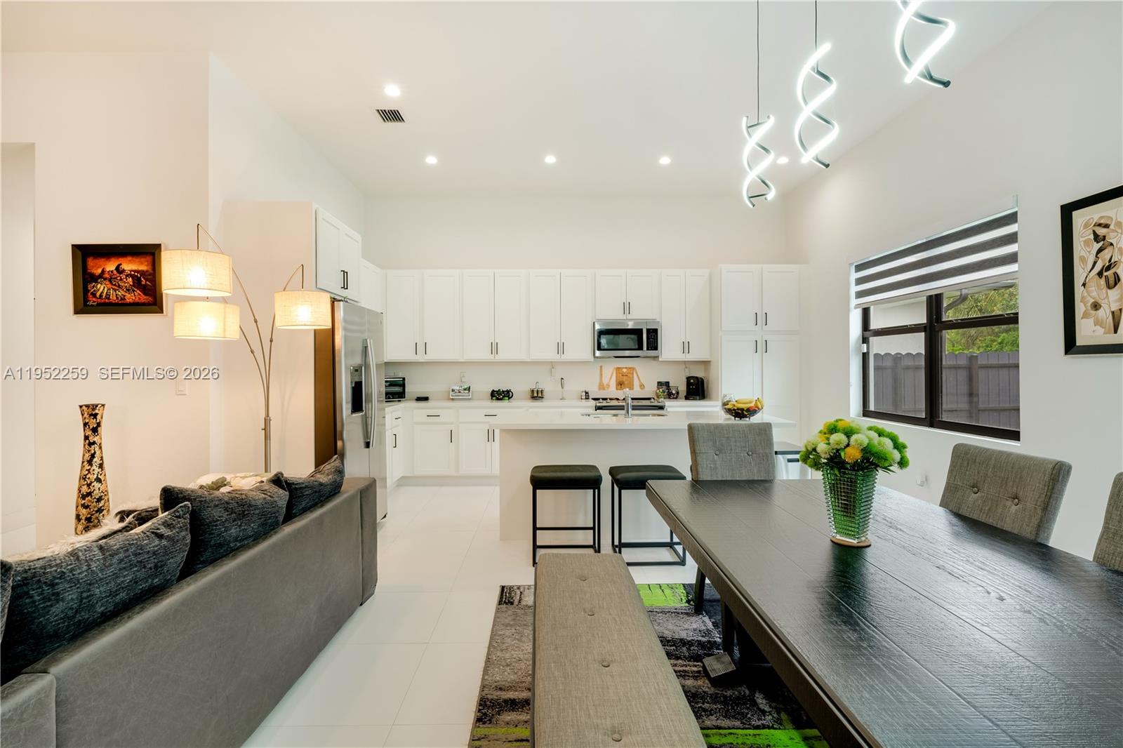 19410 Southwest 124th Court Miami, FL 33177 - Photo 6 of 33 a large white kitchen with lots of counter top space a sink and appliances