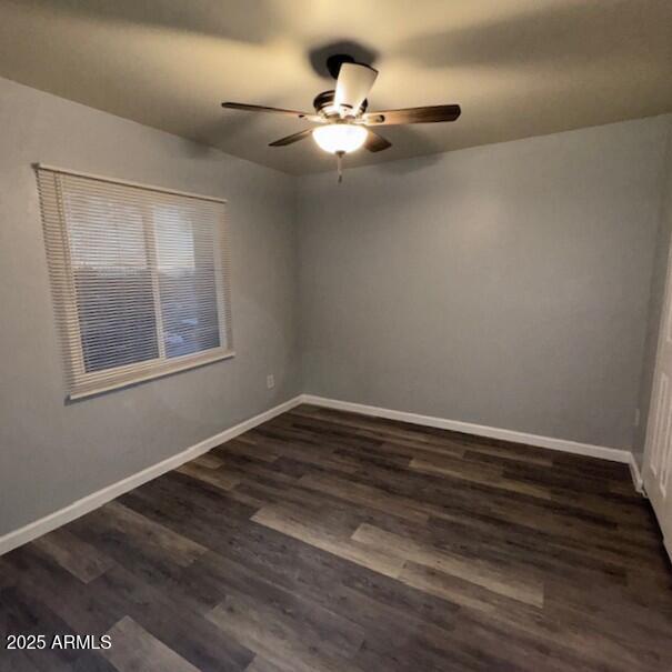 602 East Townley Avenue, Unit 306 Phoenix, AZ 85020 - Photo 12 of 23 a view of an empty room with wooden floor and a window