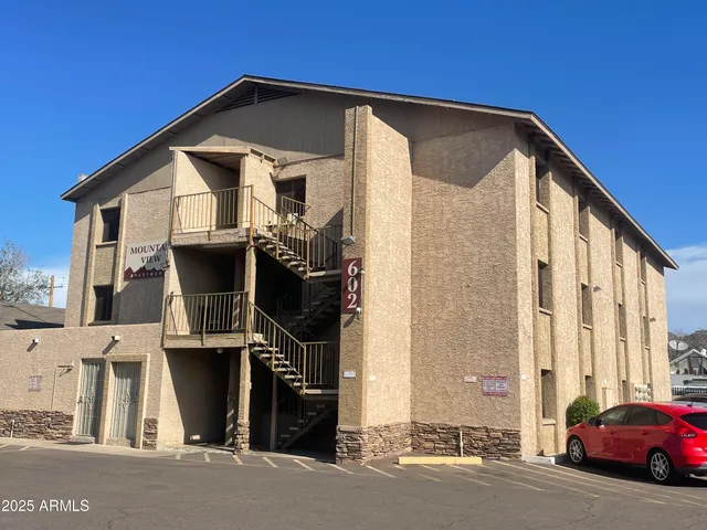 a front view of a house with parking