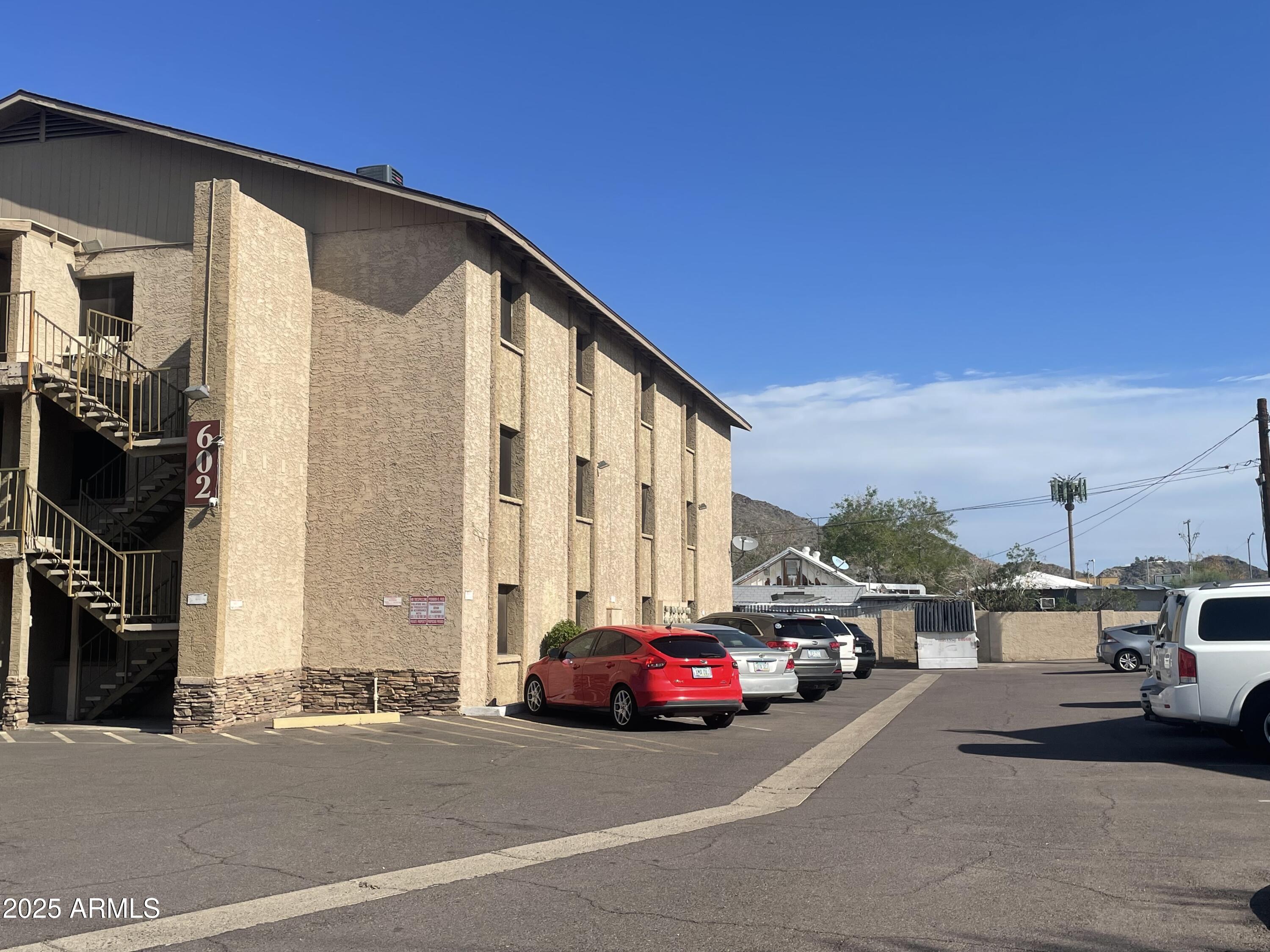 602 East Townley Avenue, Unit 306 Phoenix, AZ 85020 - Photo 16 of 23 a view of car parked in front of building