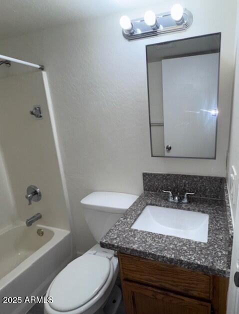 602 East Townley Avenue, Unit 306 Phoenix, AZ 85020 - Photo 9 of 23 a bathroom with a granite countertop sink a toilet and bathtub