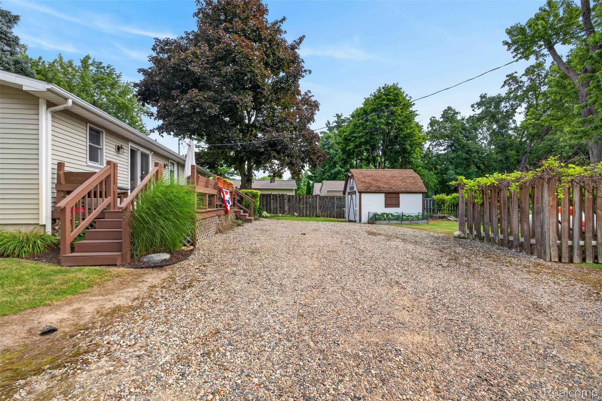 5977 Anglers Road Ortonville, MI 48462 - Photo 52 of 63 Expansive gravel driveway providing extensive off-street parking
