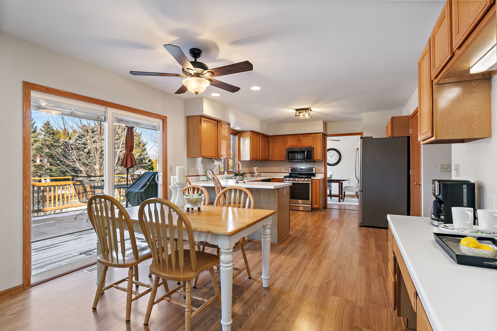 1205 South 1st Street DeKalb, IL 60115 - Photo 11 of 43 a view of a dining room with furniture a chandelier and wooden floor