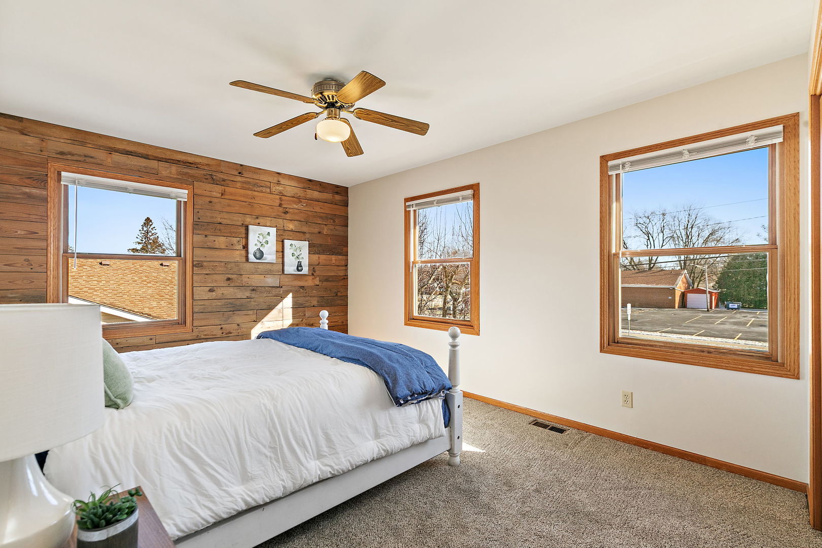 1205 South 1st Street DeKalb, IL 60115 - Photo 16 of 43 a bedroom with a bed and a painting on the wall