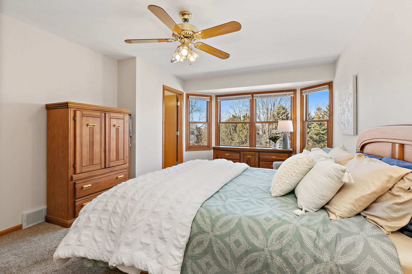 1205 South 1st Street DeKalb, IL 60115 - Photo 18 of 43 a bedroom with a large bed and a large window