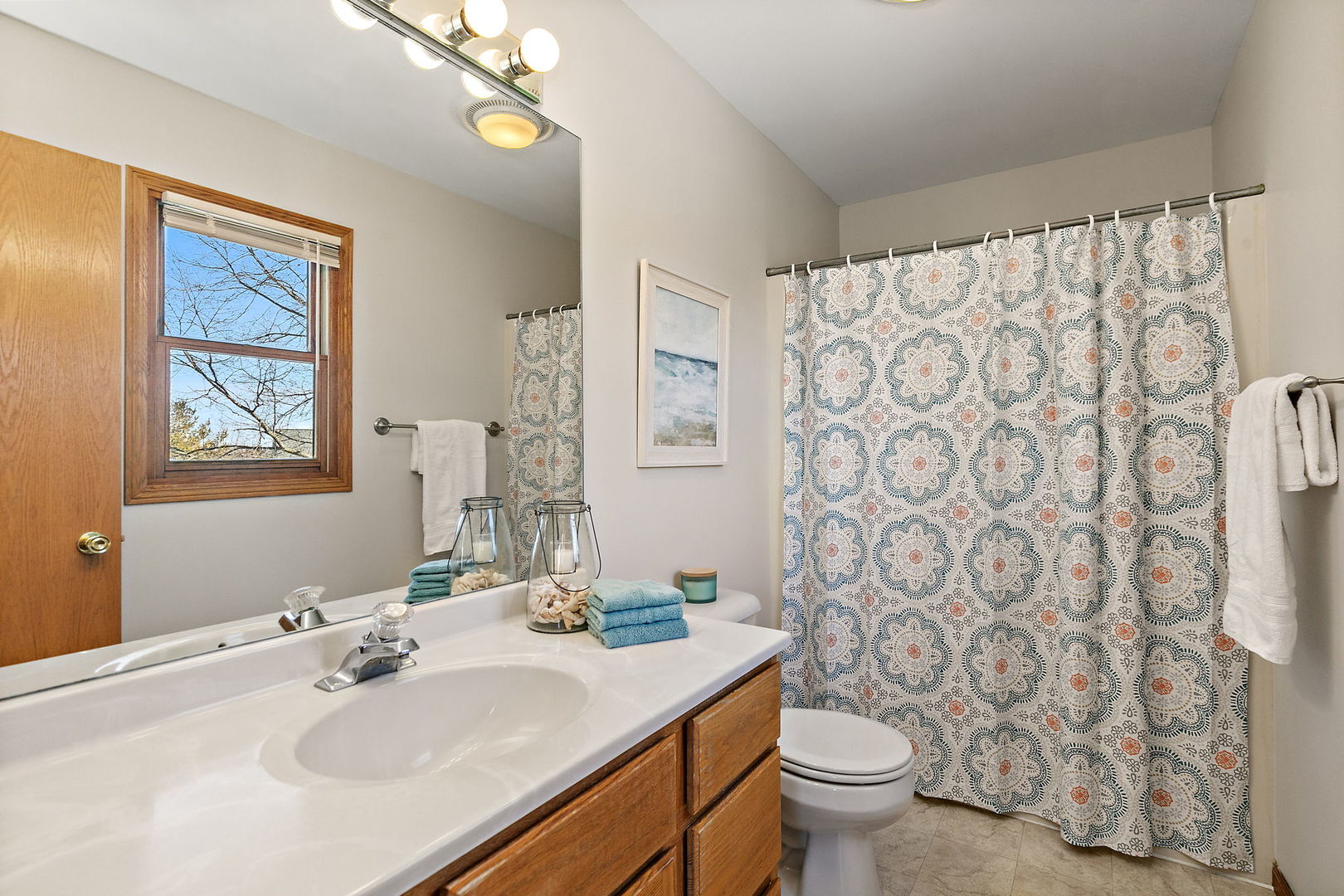 1205 South 1st Street DeKalb, IL 60115 - Photo 19 of 43 a bathroom with a sink toilet and a mirror
