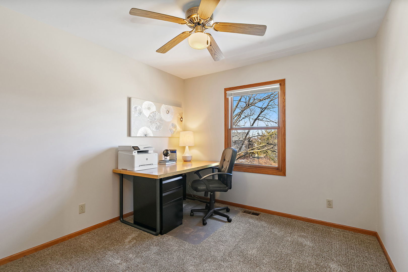 1205 South 1st Street DeKalb, IL 60115 - Photo 21 of 43 a view of a workspace with furniture and a window
