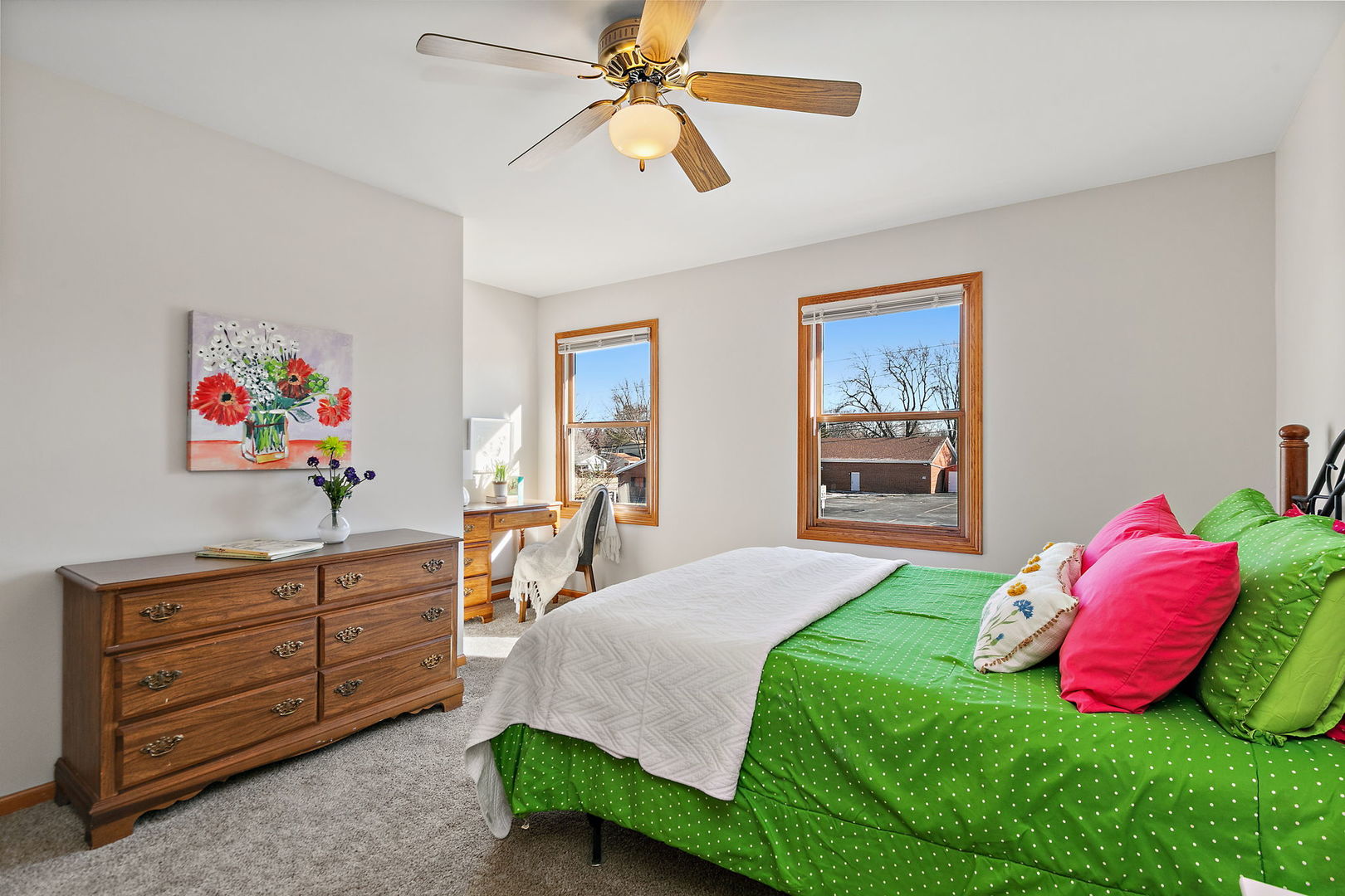 1205 South 1st Street DeKalb, IL 60115 - Photo 23 of 43 a bedroom with a bed and a dresser in it