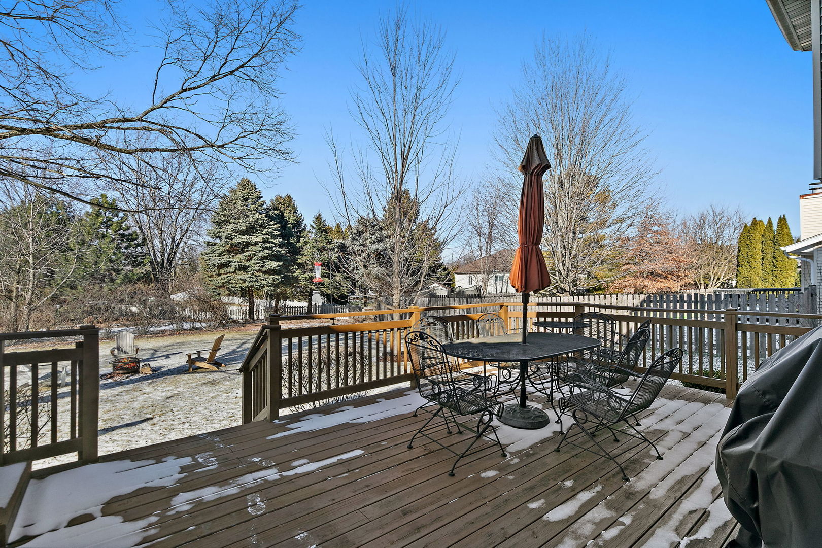 1205 South 1st Street DeKalb, IL 60115 - Photo 28 of 43 a view of a chairs and table on the wooden deck