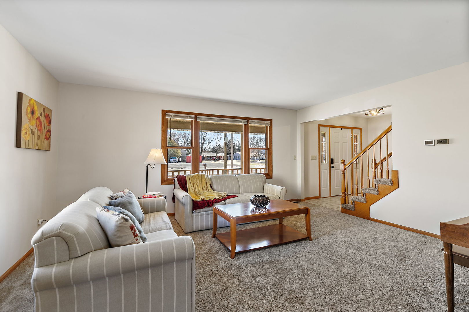 1205 South 1st Street DeKalb, IL 60115 - Photo 6 of 43 a living room with furniture and a window