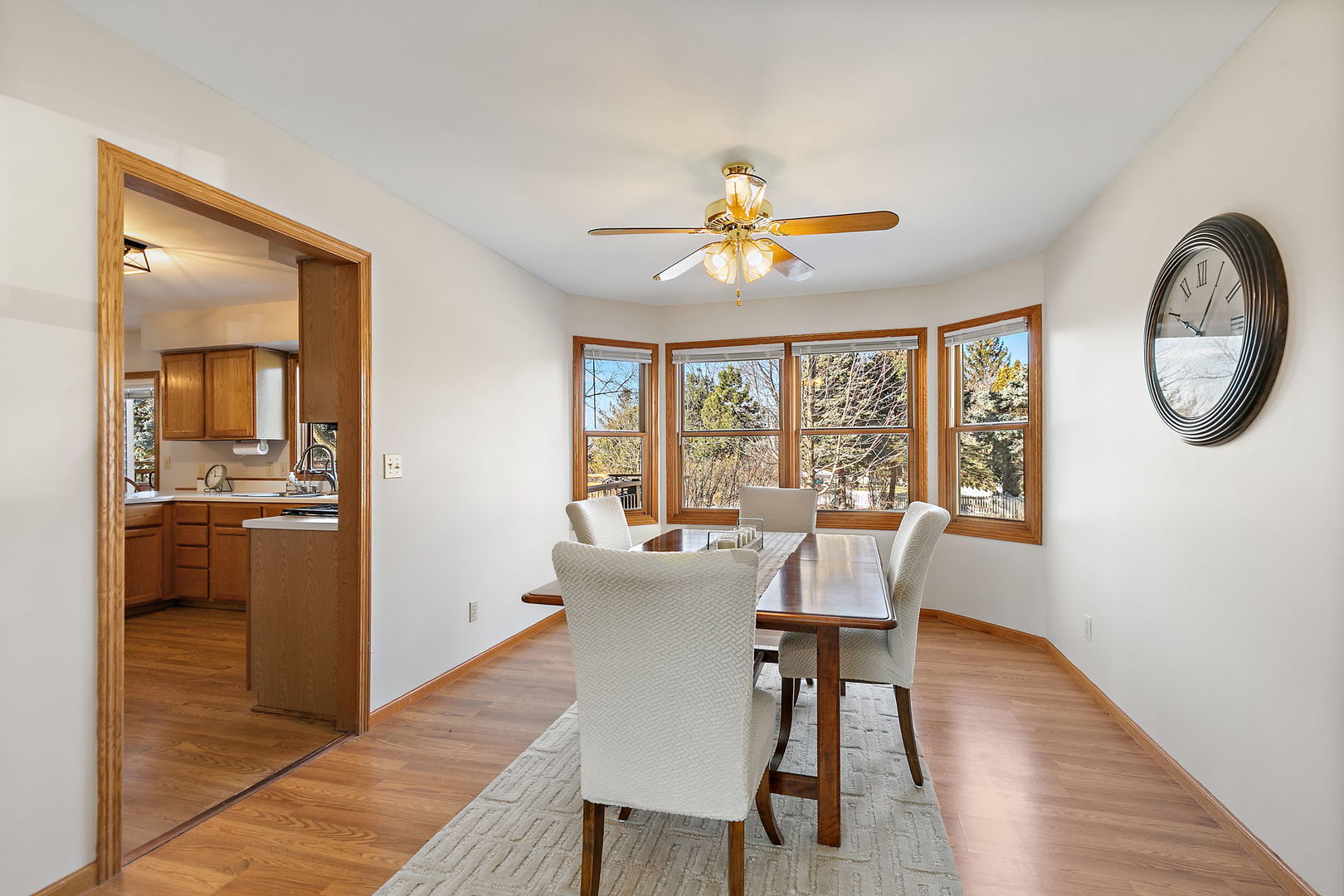 1205 South 1st Street DeKalb, IL 60115 - Photo 7 of 43 a view of a dining room with furniture a chandelier and wooden floor
