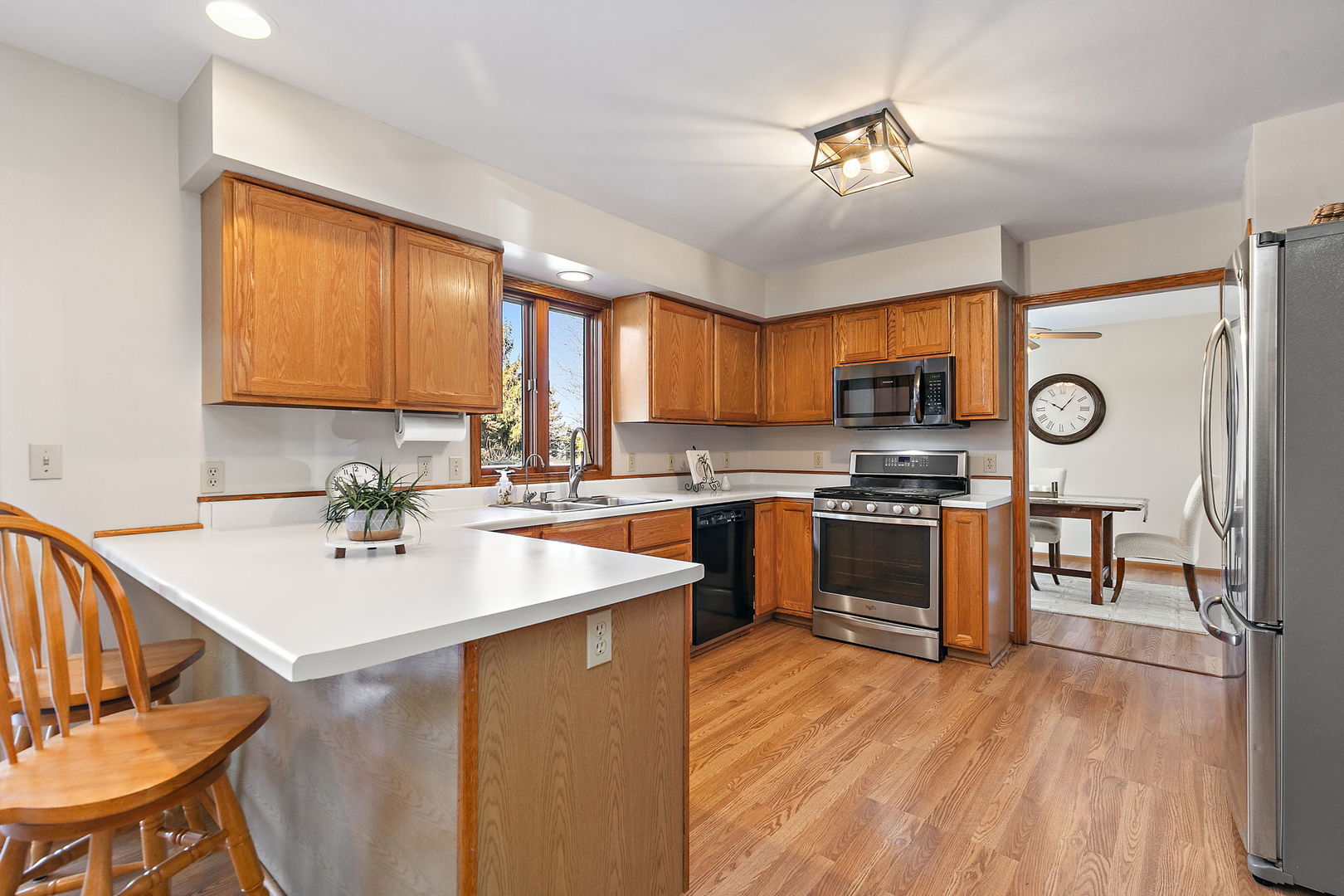 1205 South 1st Street DeKalb, IL 60115 - Photo 9 of 43 a kitchen with a sink appliances and cabinets