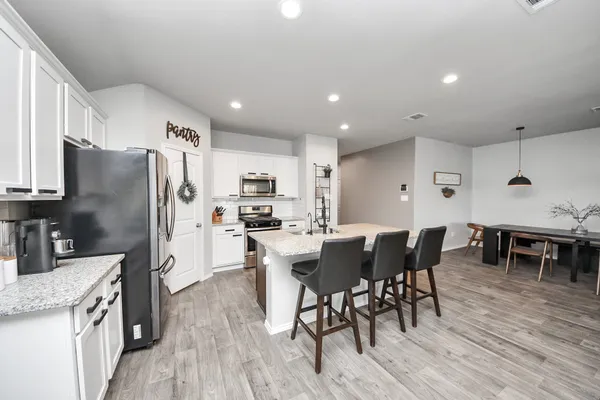 a bathroom with a double vanity sink and mirror