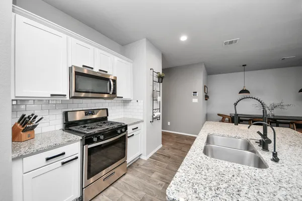 a living room with a floor to ceiling window and a table