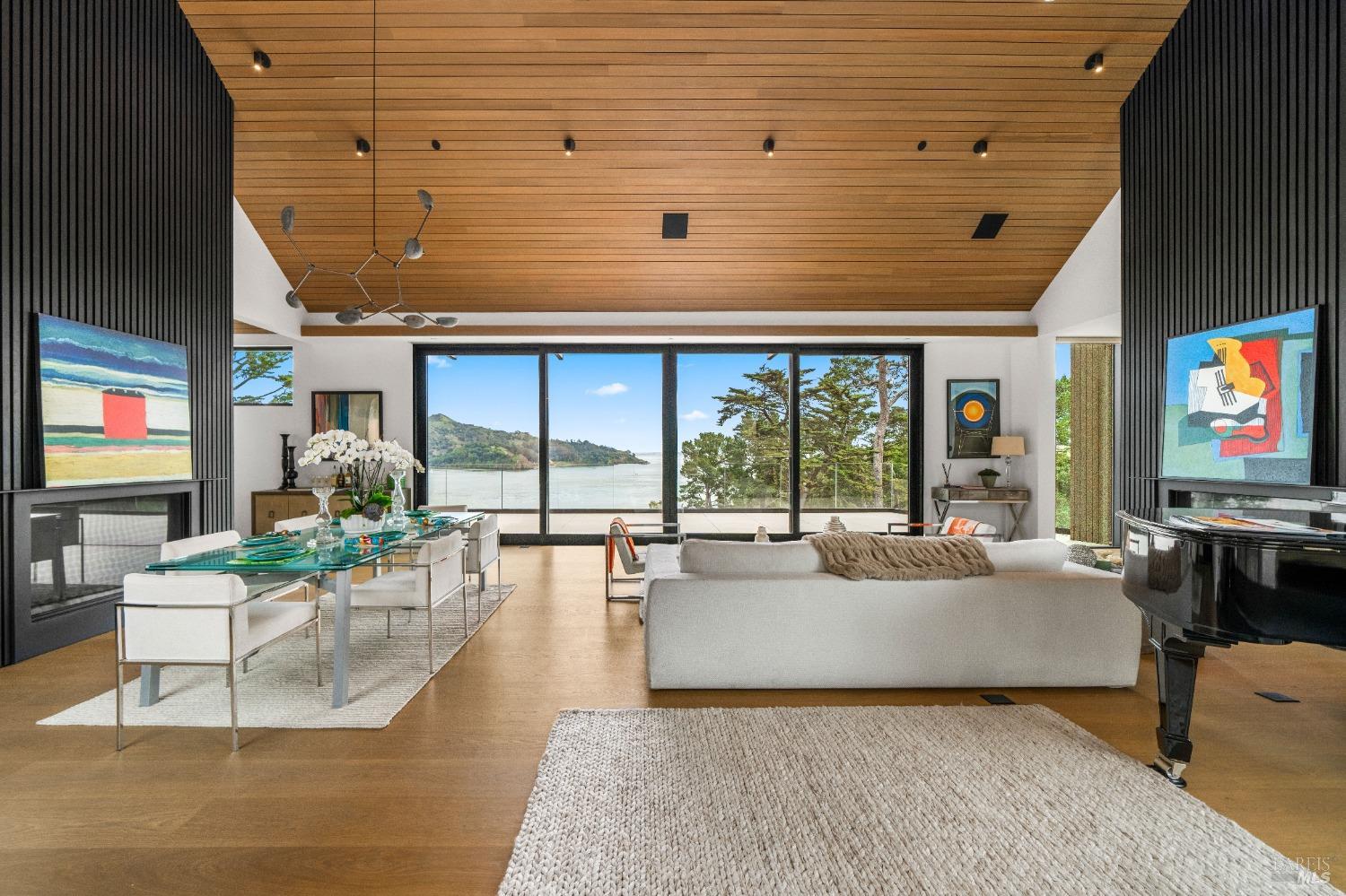 a living room with fireplace furniture and a flat screen tv