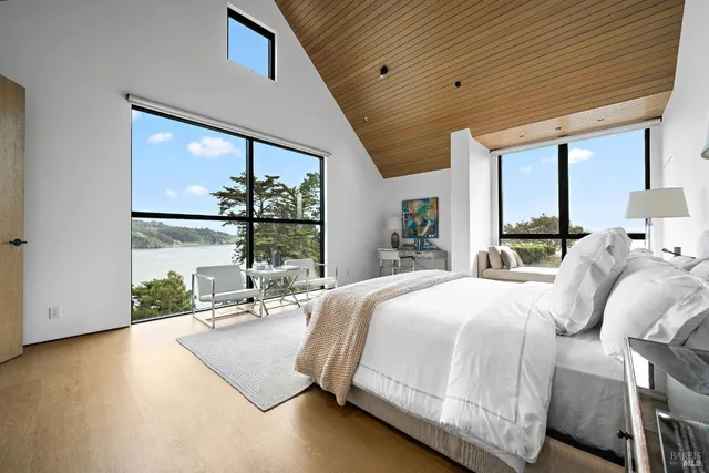 a living room with furniture a large window with outer view