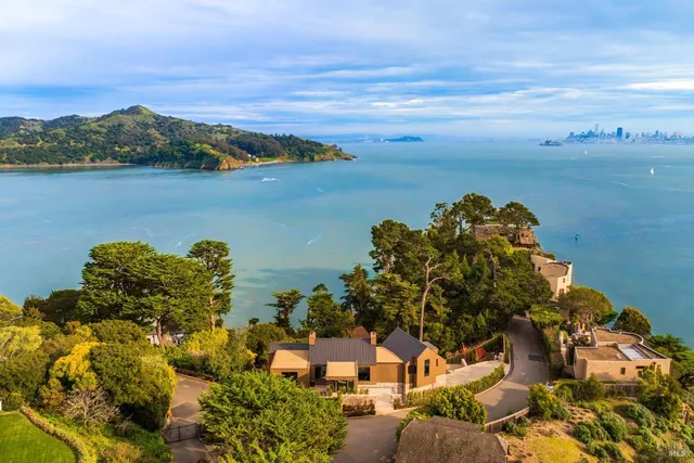 a view of house with backyard and outdoor seating