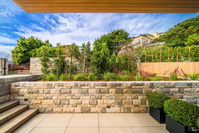a lobby with furniture and floor to ceiling window