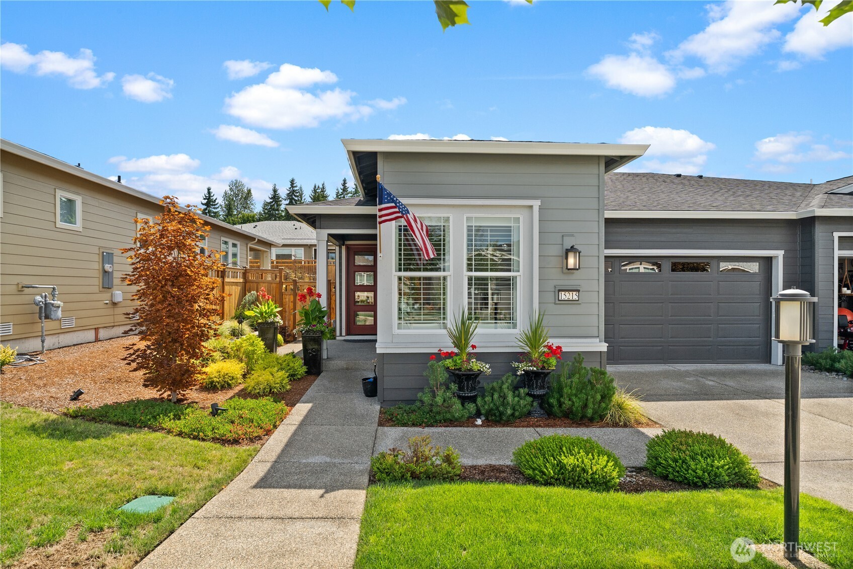 15215 182nd Avenue East Bonney Lake, WA 98391 - Photo 1 of 40 a front view of a house with garden