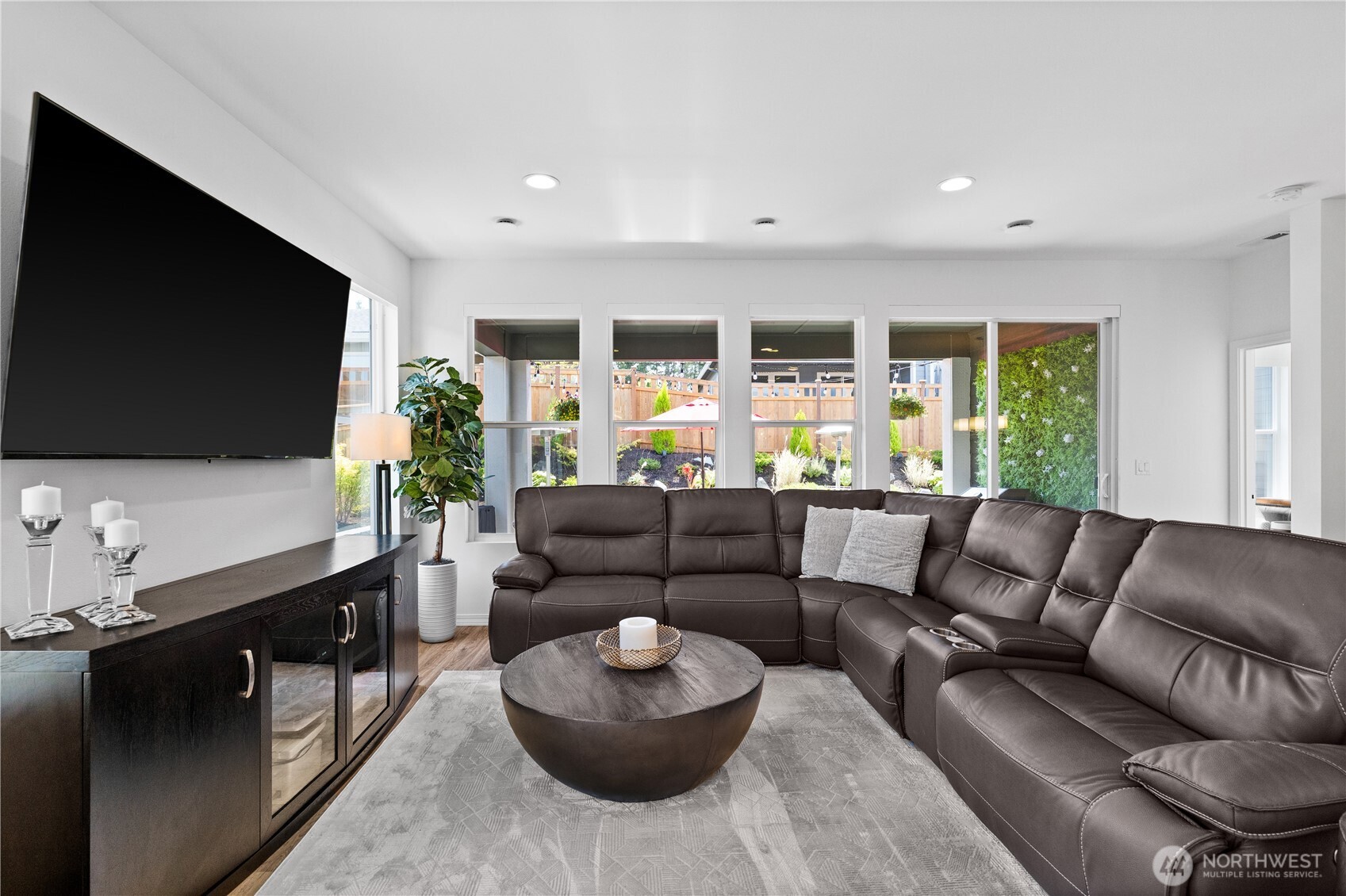 15215 182nd Avenue East Bonney Lake, WA 98391 - Photo 13 of 40 a living room with furniture and a flat screen tv