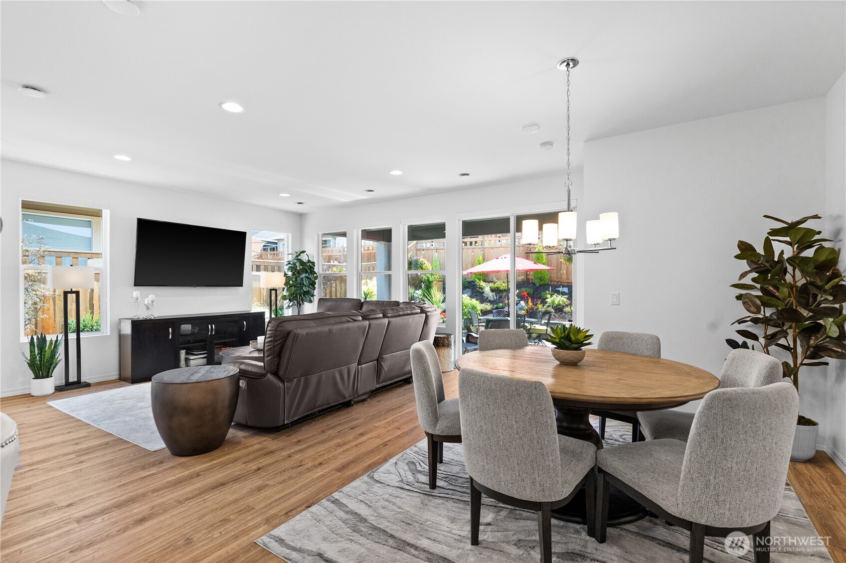15215 182nd Avenue East Bonney Lake, WA 98391 - Photo 15 of 40 a view of a dining room with furniture and wooden floor