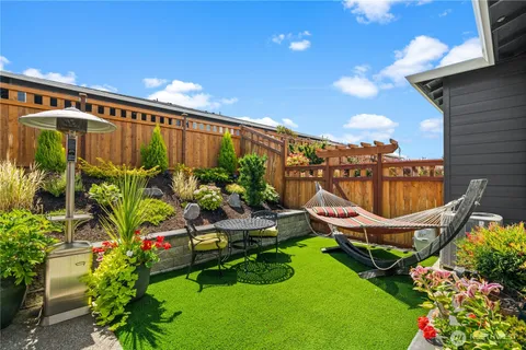 a view of a chair and tables in the patio