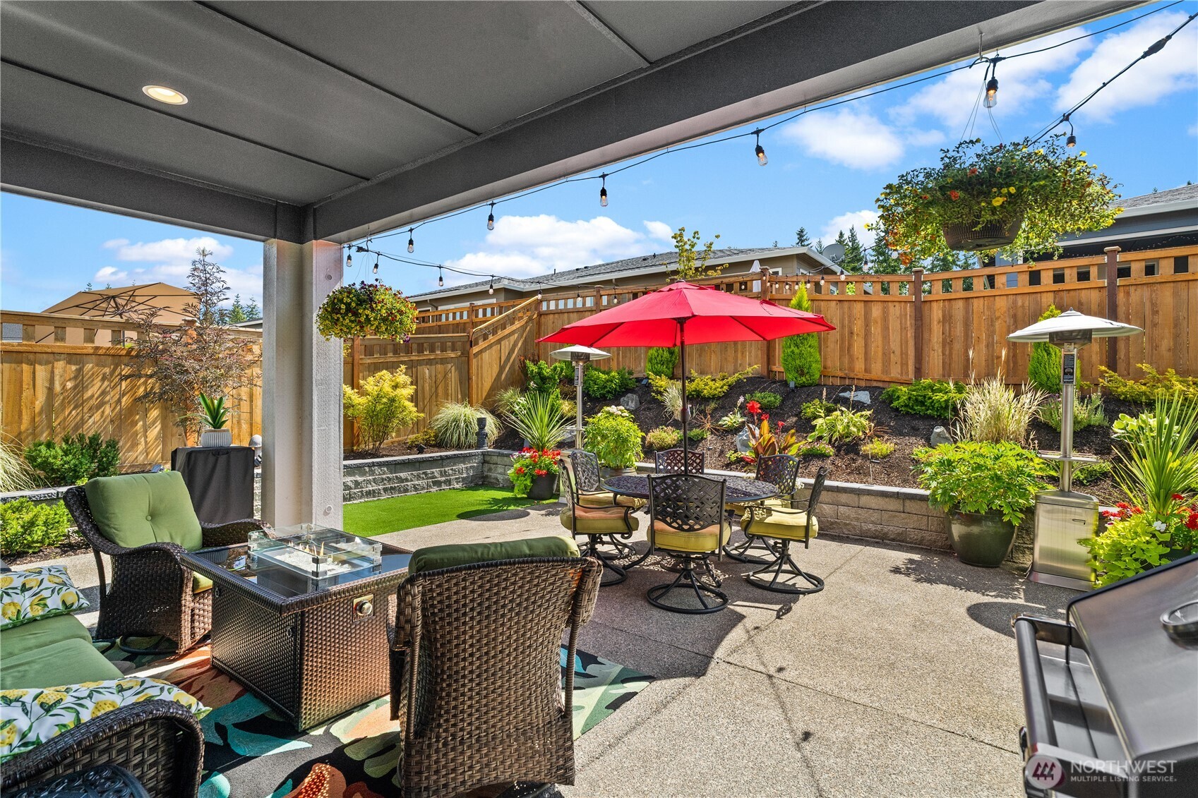 15215 182nd Avenue East Bonney Lake, WA 98391 - Photo 36 of 40 a view of a patio with chairs and potted plants